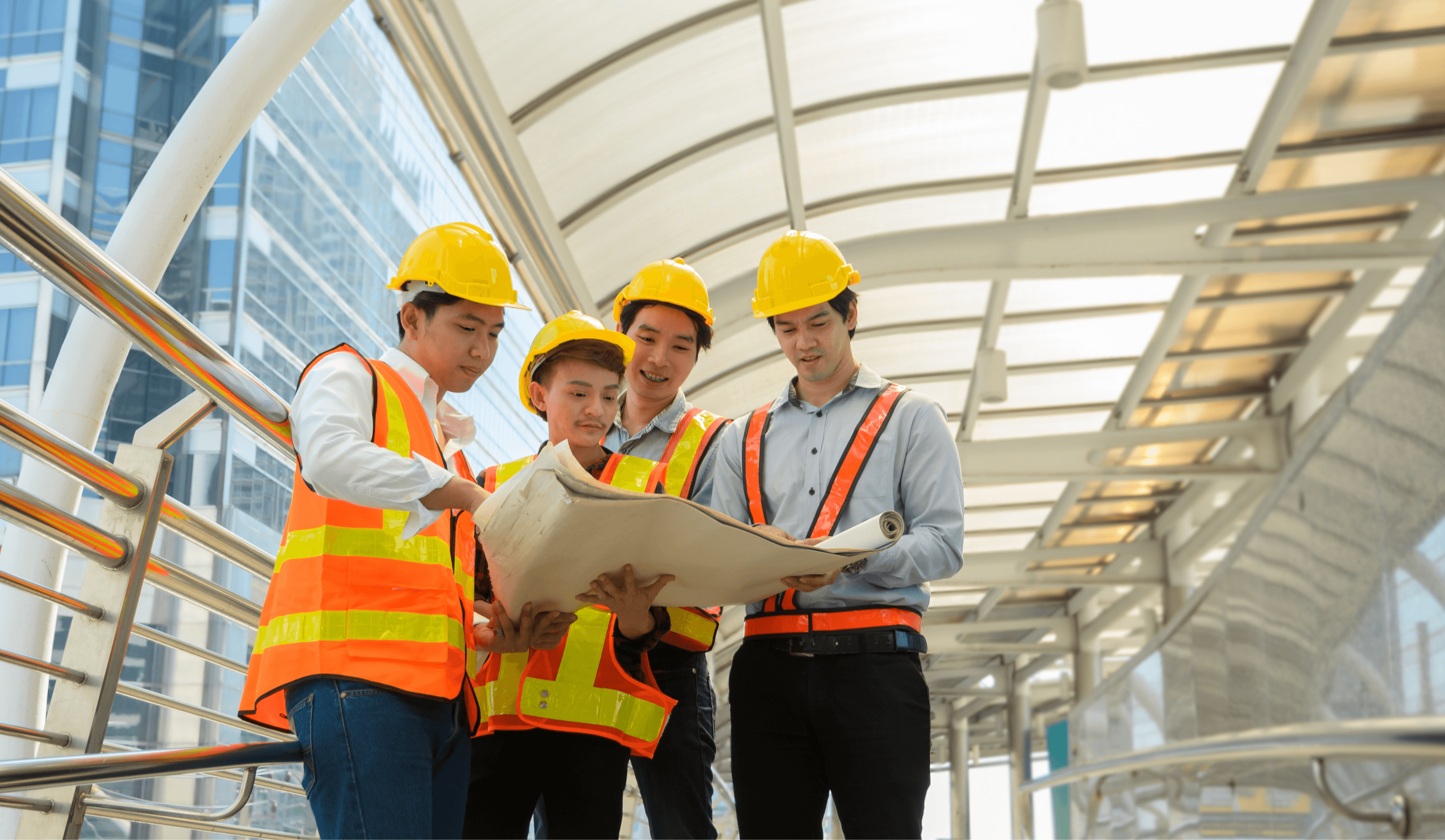 Engineers reviewing blueprints